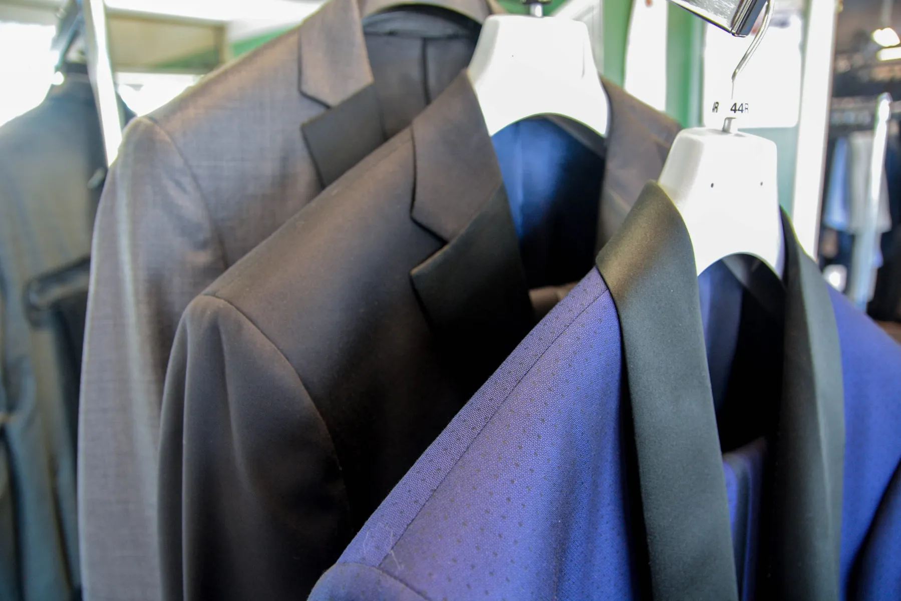 Rack of men's suits for sale